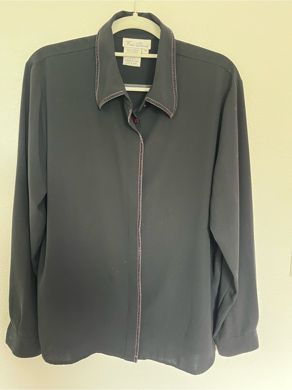 Fred David Black Long Sleeve Blouse with velvet trim and red button detail.
